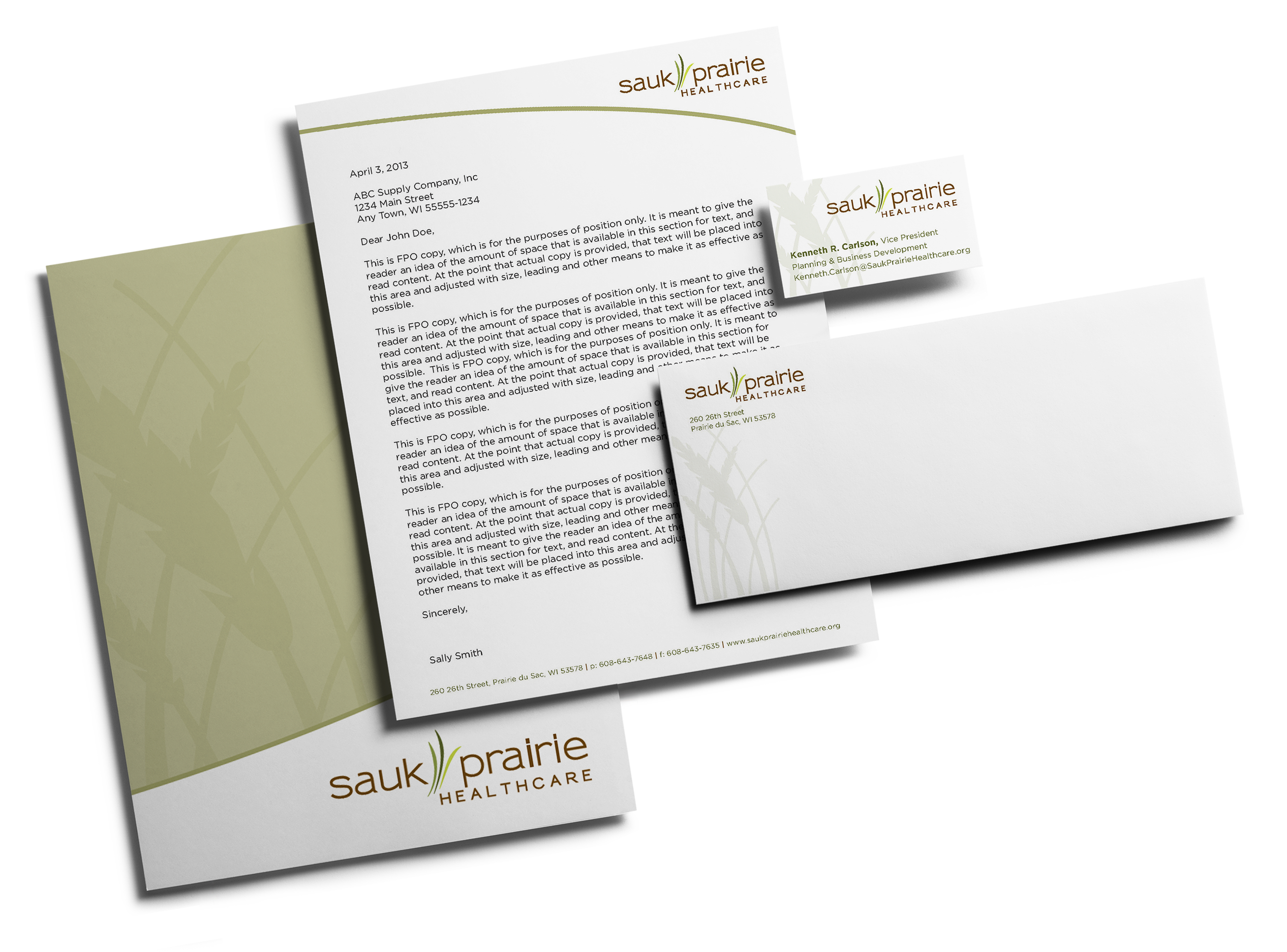 Sauk Prairie Healthcare branded stationery folder business card envelope